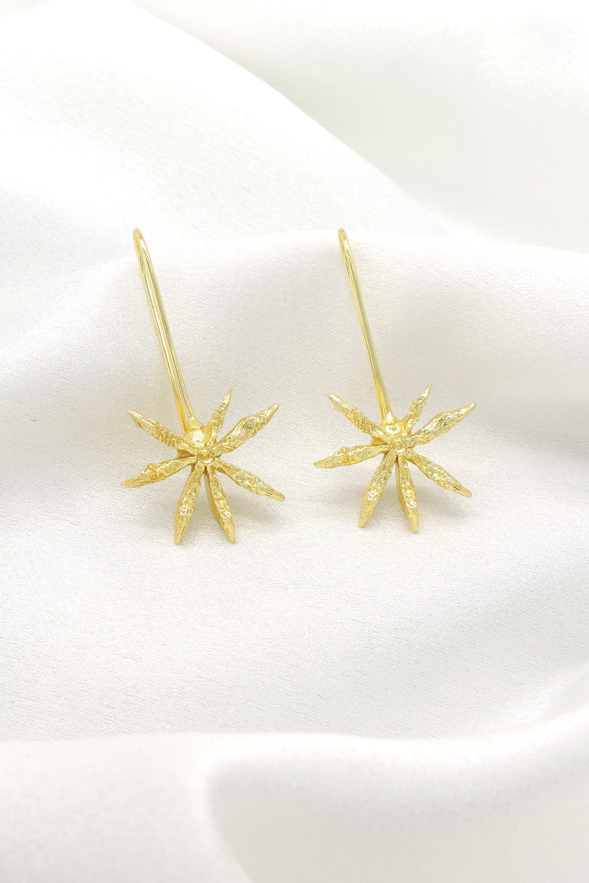 Gold Starburst Drop Earrings | Minimal Statement Long Hook Earrings | Joyrias