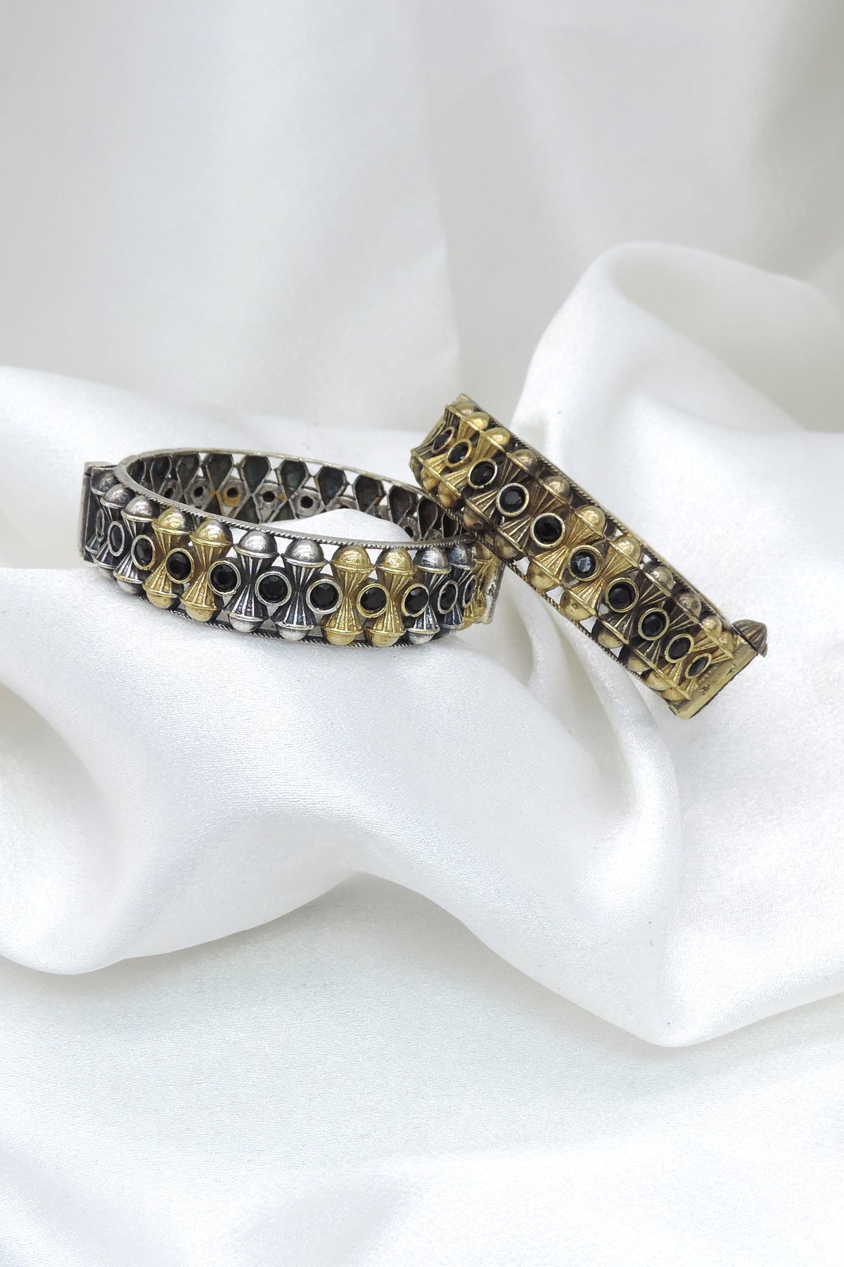 Oxidized dual-tone gold silver bangle set with black stone geometric detailing by joyrias