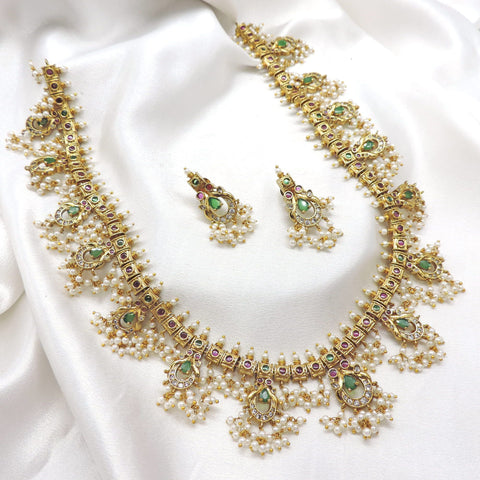 Elegant ruby emerald CZ AD temple necklace set with traditional detailing by joyrias