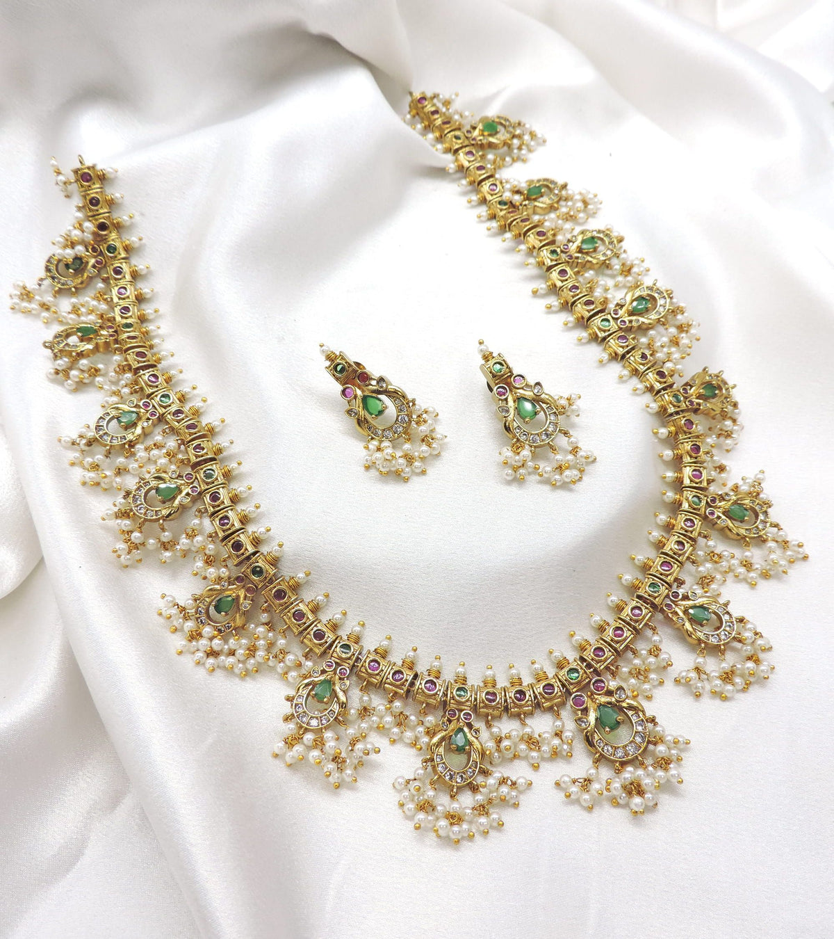Elegant ruby emerald CZ AD temple necklace set with traditional detailing by joyrias