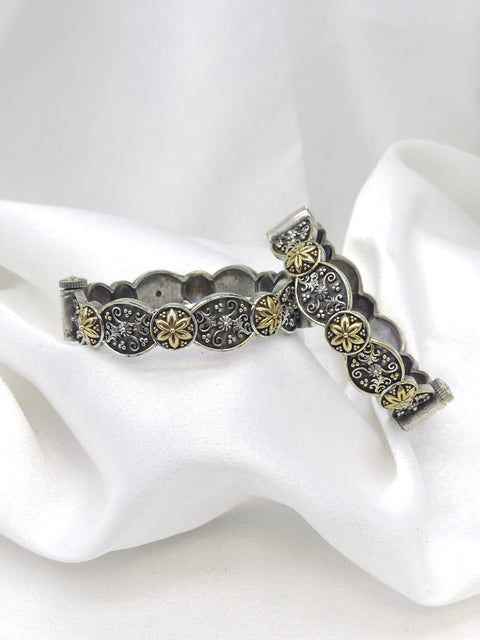 Oxidized dual-tone floral openable bangle set with gold-toned detailing by joyrias