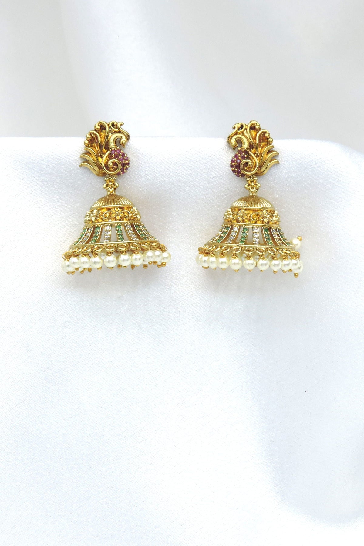 Gold-toned kundan floral jhumka earrings with green, maroon and pearl detailing by joyrias