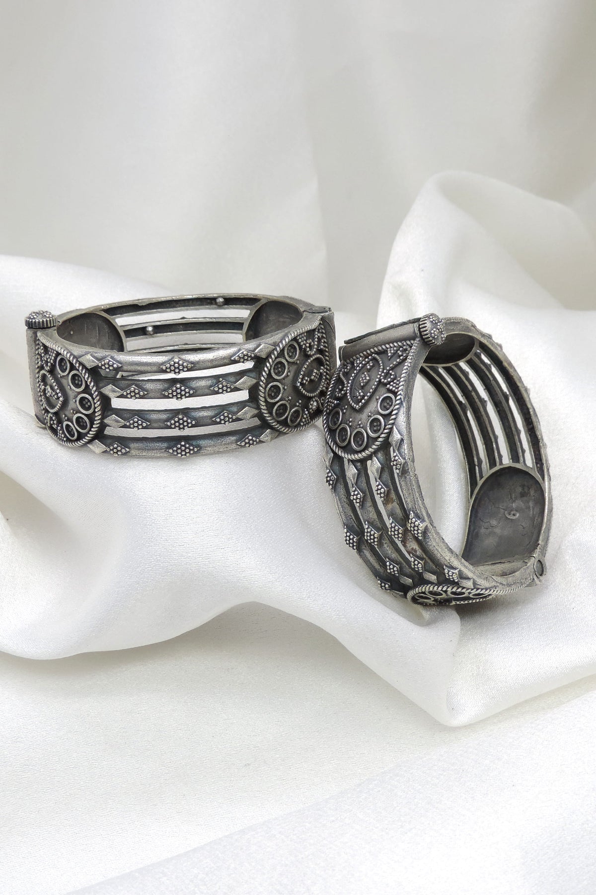 Oxidized silver tribal pattern openable bangle set with intricate detailing by joyrias
