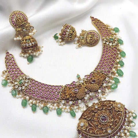 Royal ruby emerald pearl temple necklace set with ornate pendant and matching earrings by joyrias