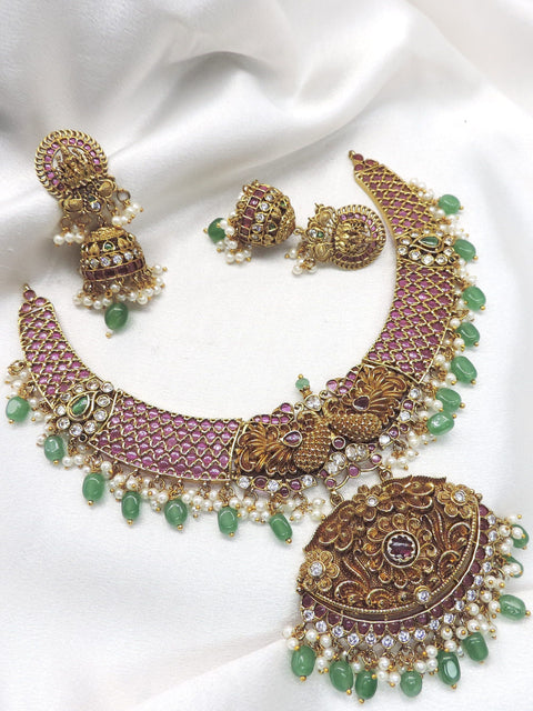 Royal ruby emerald pearl temple necklace set with ornate pendant and matching earrings by joyrias