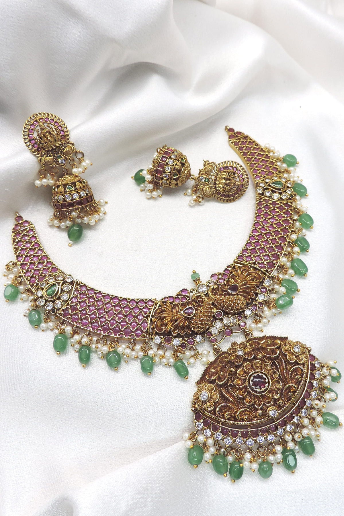 Royal ruby emerald pearl temple necklace set with ornate pendant and matching earrings by joyrias