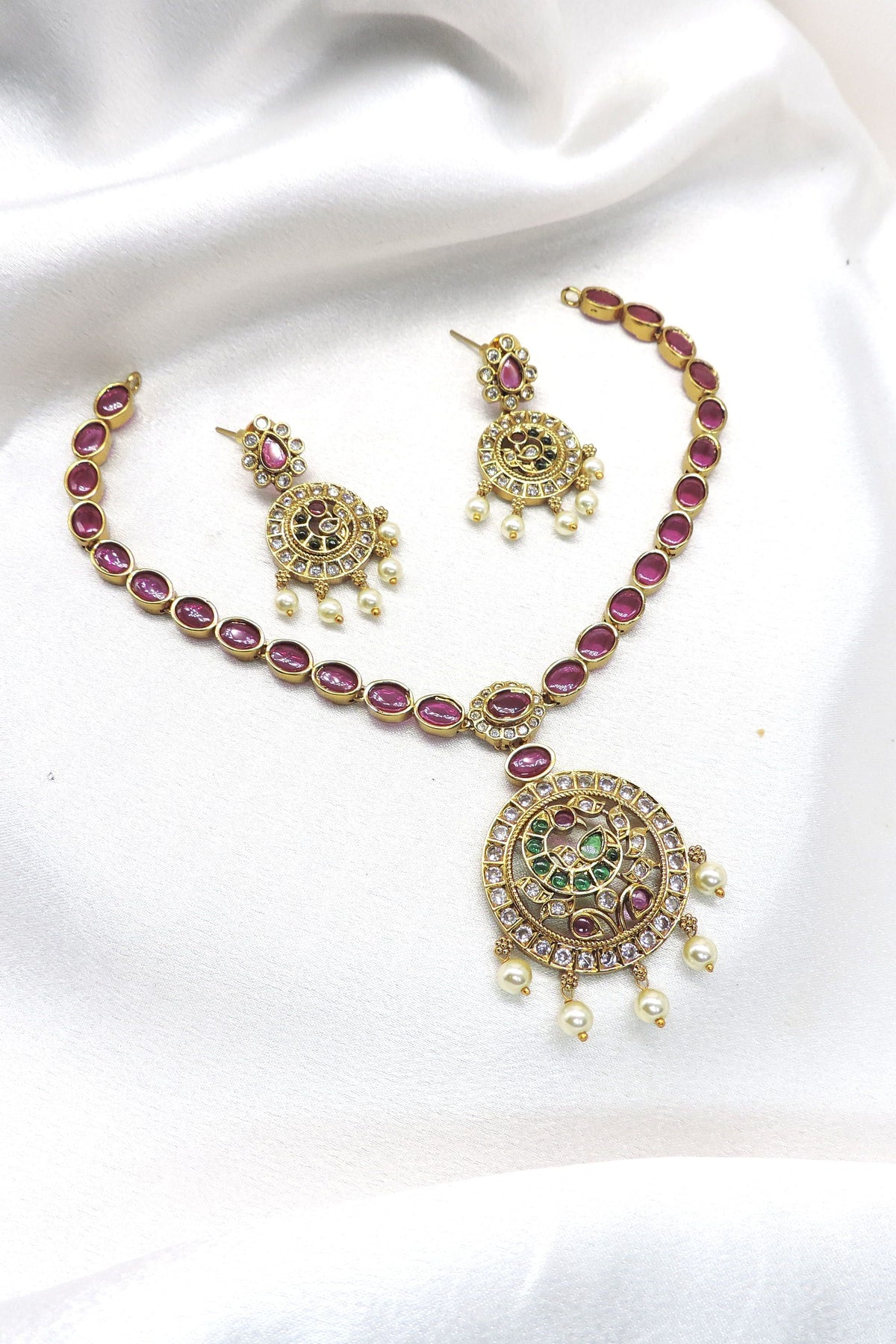 Ruby CZ AD necklace set with pearl drop detailing and gold-tone finish by joyrias