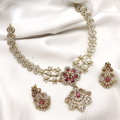 Pink floral CZ AD necklace set with matching earrings and gold-tone detailing by joyrias