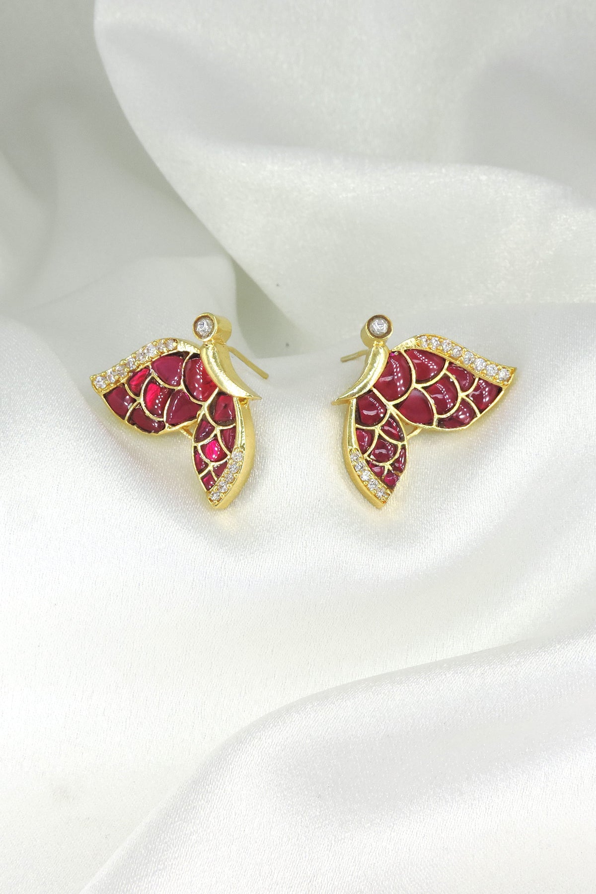 Ruby wing stud earrings by Joyrias