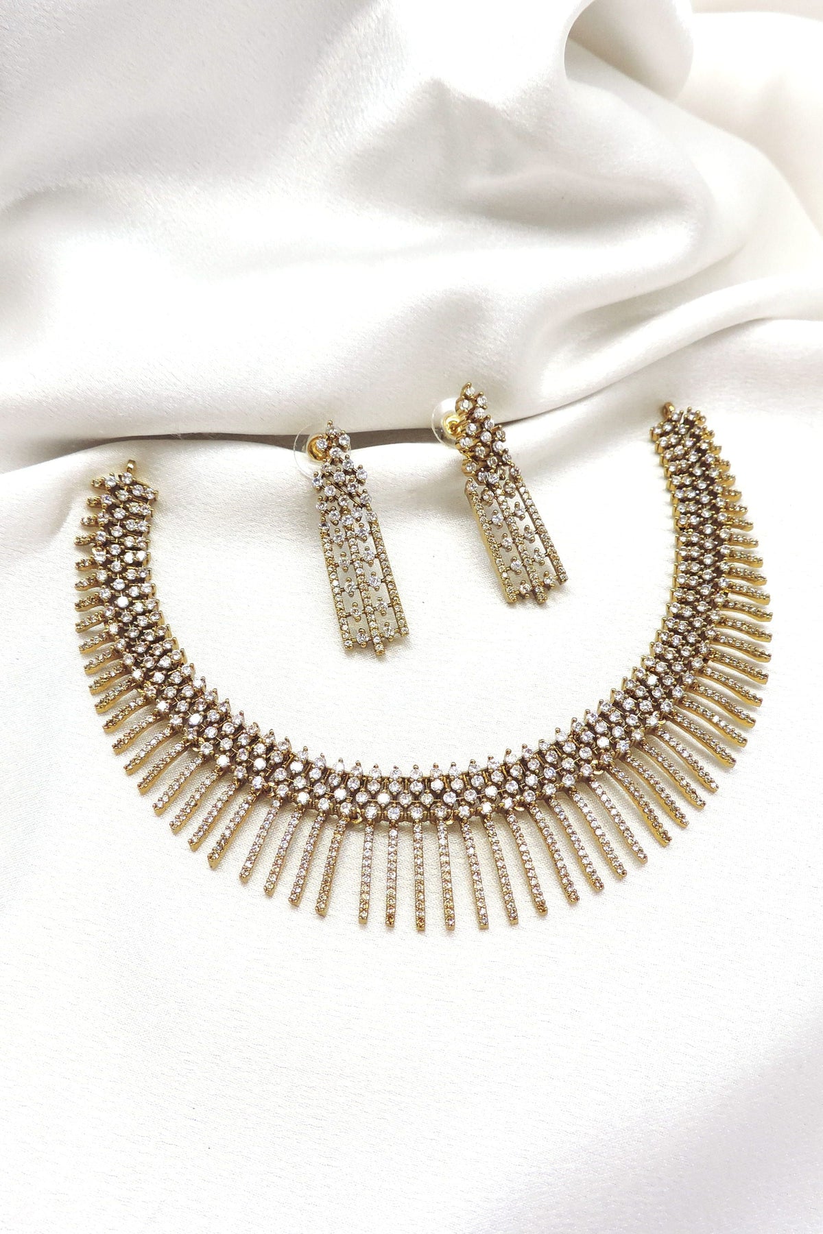 Gold-tone CZ AD fringe necklace set with matching long drop earrings by joyrias