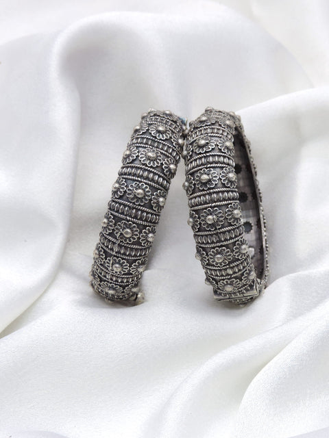 Oxidized silver floral openable bangle set with intricate traditional detailing by joyrias