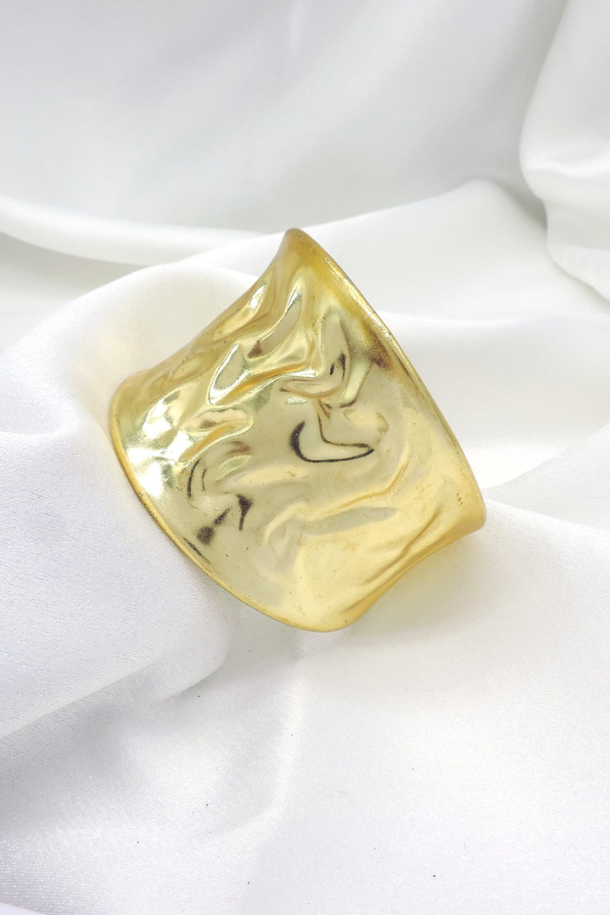 Molten gold sculpted cuff bracelet by Joyrias