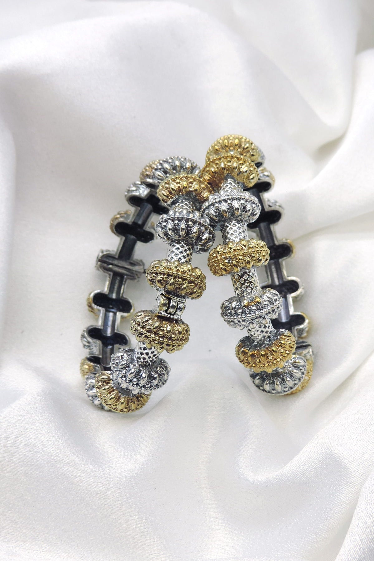 Oxidized dual-tone gold silver beaded bangle set with intricate textured detailing by joyrias