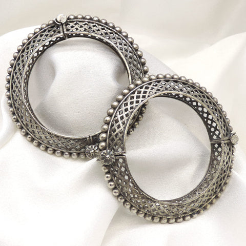 Oxidized silver lattice beaded bangle set with intricate openwork and floral detailing by joyrias
