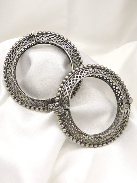 Oxidized silver lattice beaded bangle set with intricate openwork and floral detailing by joyrias