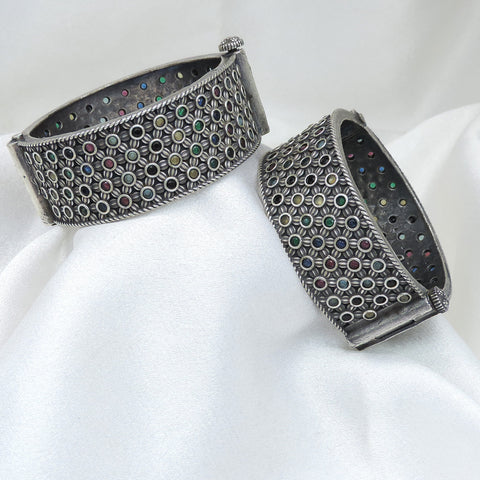 Oxidized silver multicolor floral bangle set with intricate openwork and colorful stone detailing by joyrias