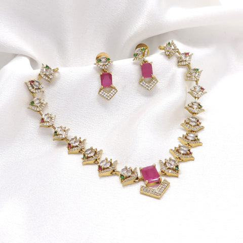 Gold-toned pink AD CZ necklace set with geometric motifs and matching earrings by joyrias