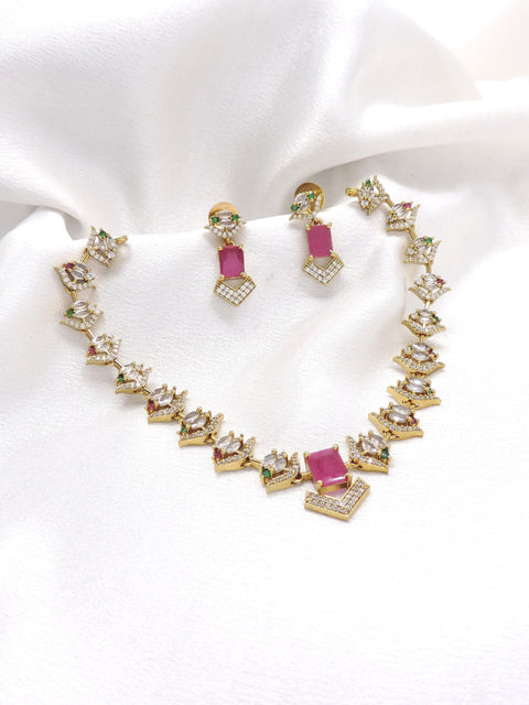 Gold-toned pink AD CZ necklace set with geometric motifs and matching earrings by joyrias