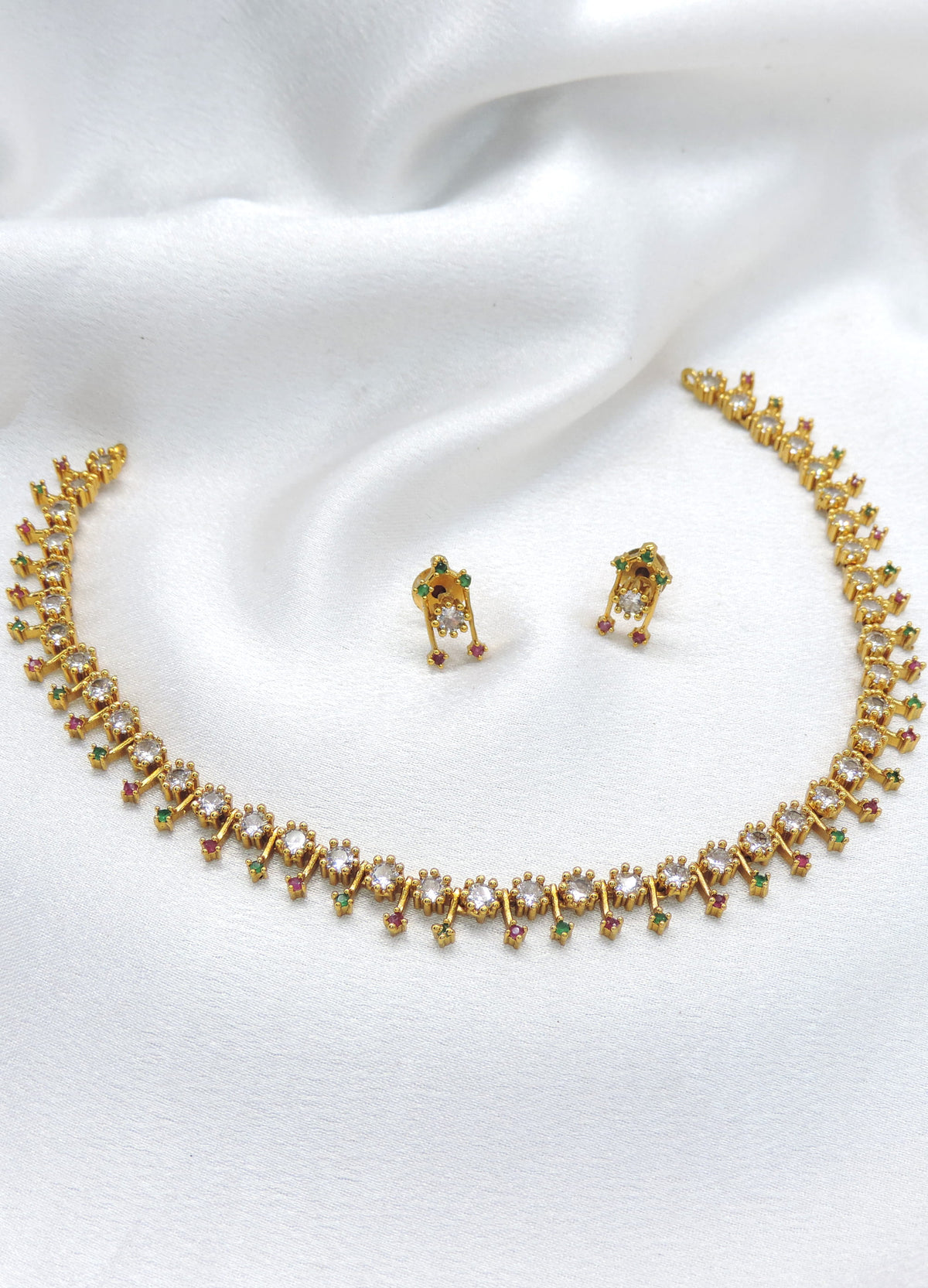 Gold-toned multicolor floral CZ necklace set with green and pink stones and matching earrings by joyrias