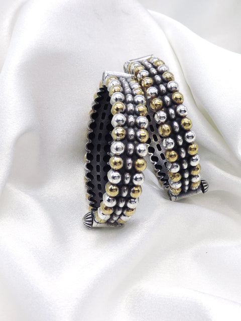 Oxidized dual-tone silver gold beaded bangle set with textured detailing by joyrias