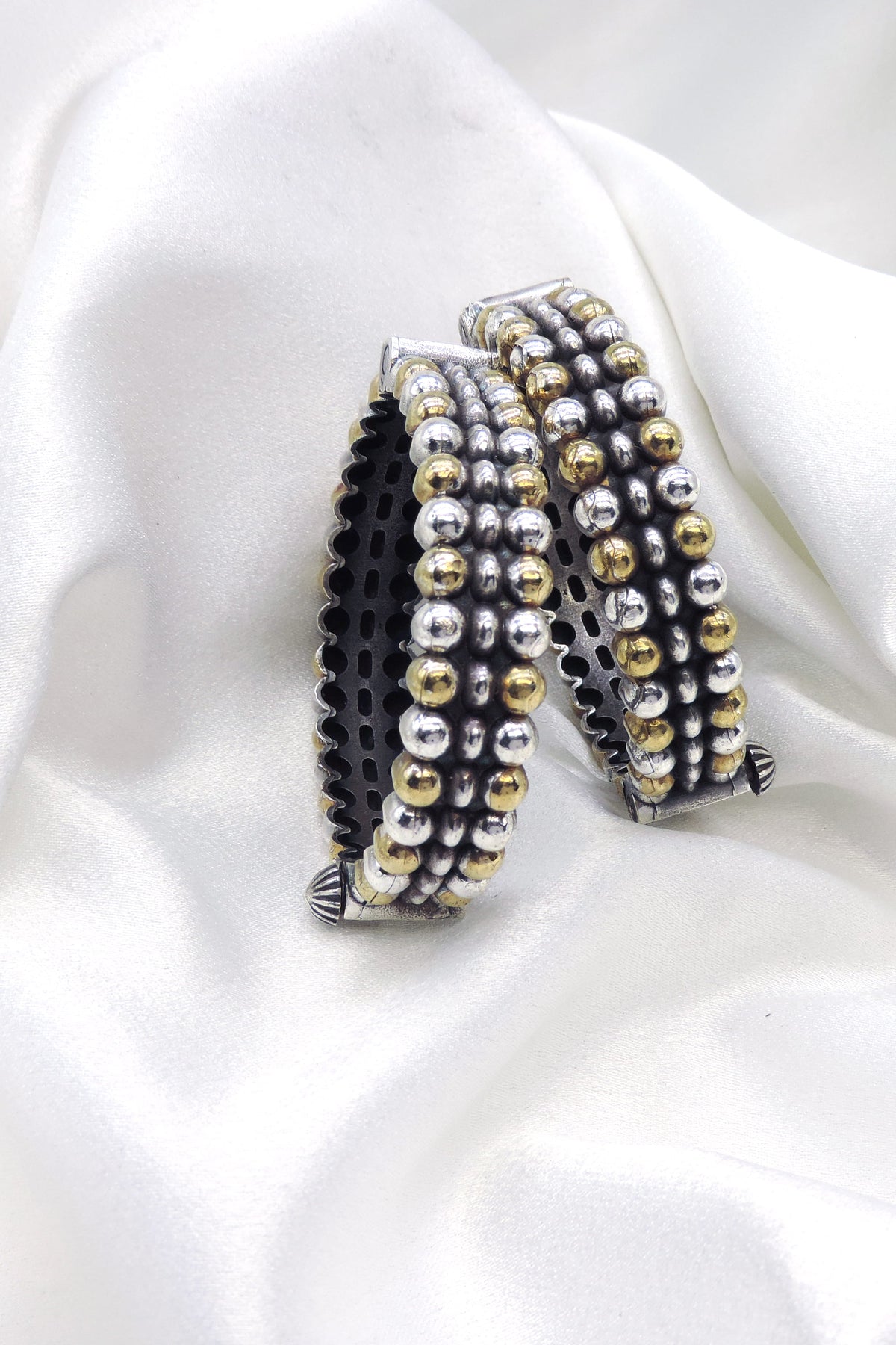 Oxidized dual-tone silver gold beaded bangle set with textured detailing by joyrias