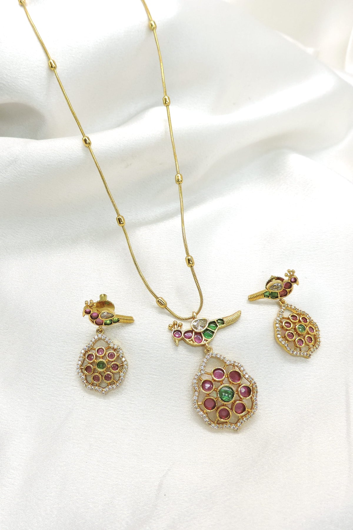 Traditional peacock kundan motif gold-tone pendant set