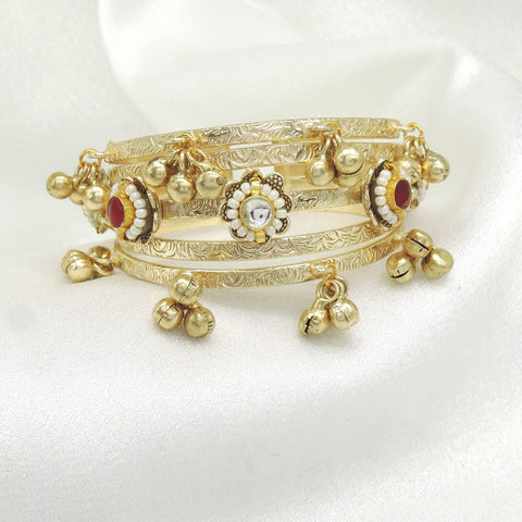 Gold tone ghungroo kundan bangle by Joyrias
