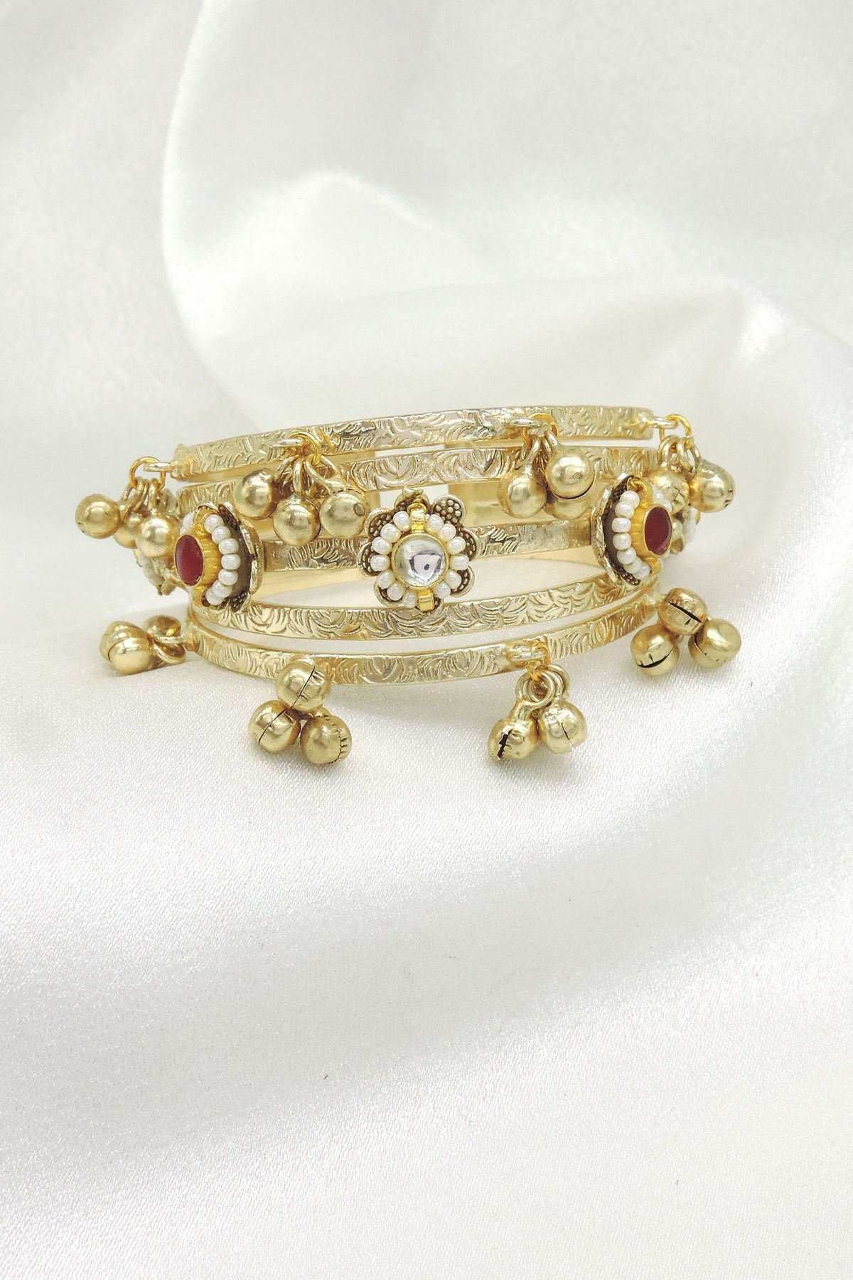 Gold tone ghungroo kundan bangle by Joyrias