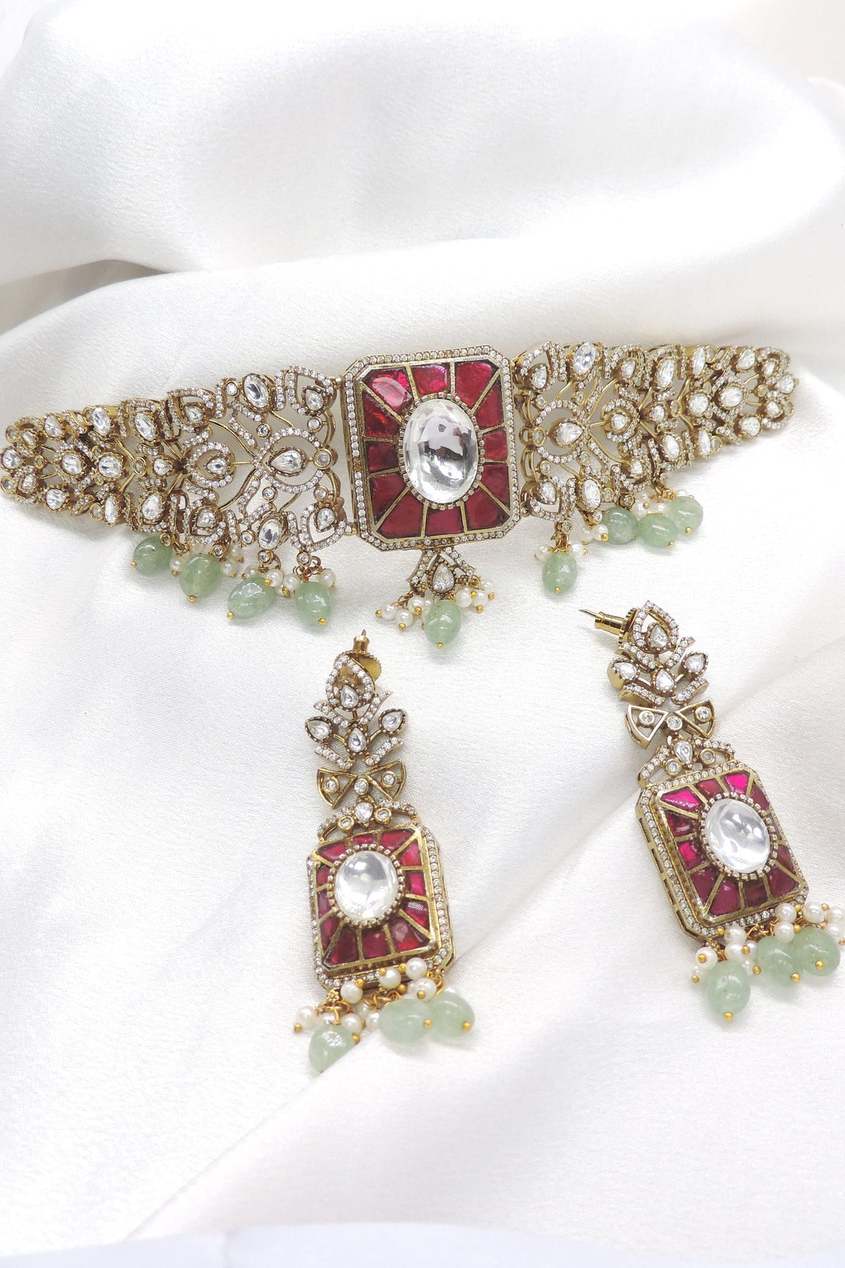 Regal ruby emerald kundan choker necklace set with matching earrings by joyrias