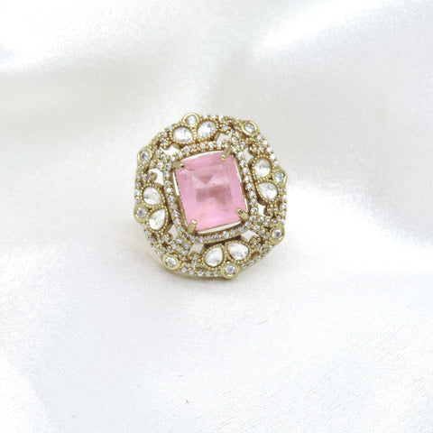 Charming pink stone ring with gold-toned detailing and sparkling accents by joyrias
