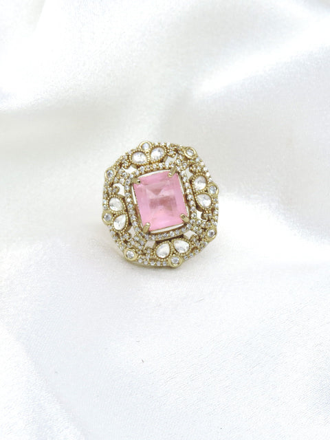 Charming pink stone ring with gold-toned detailing and sparkling accents by joyrias