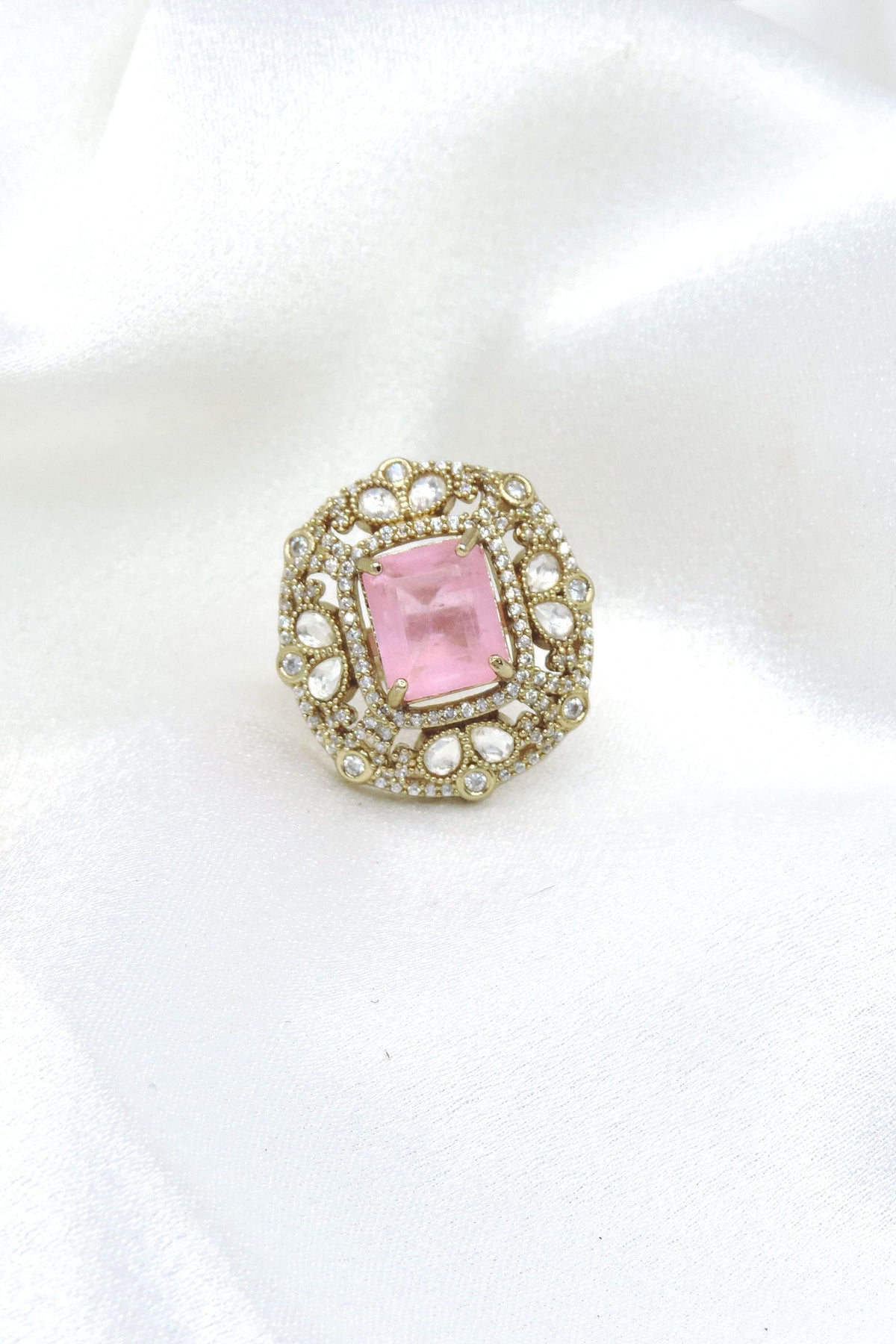 Charming pink stone ring with gold-toned detailing and sparkling accents by joyrias