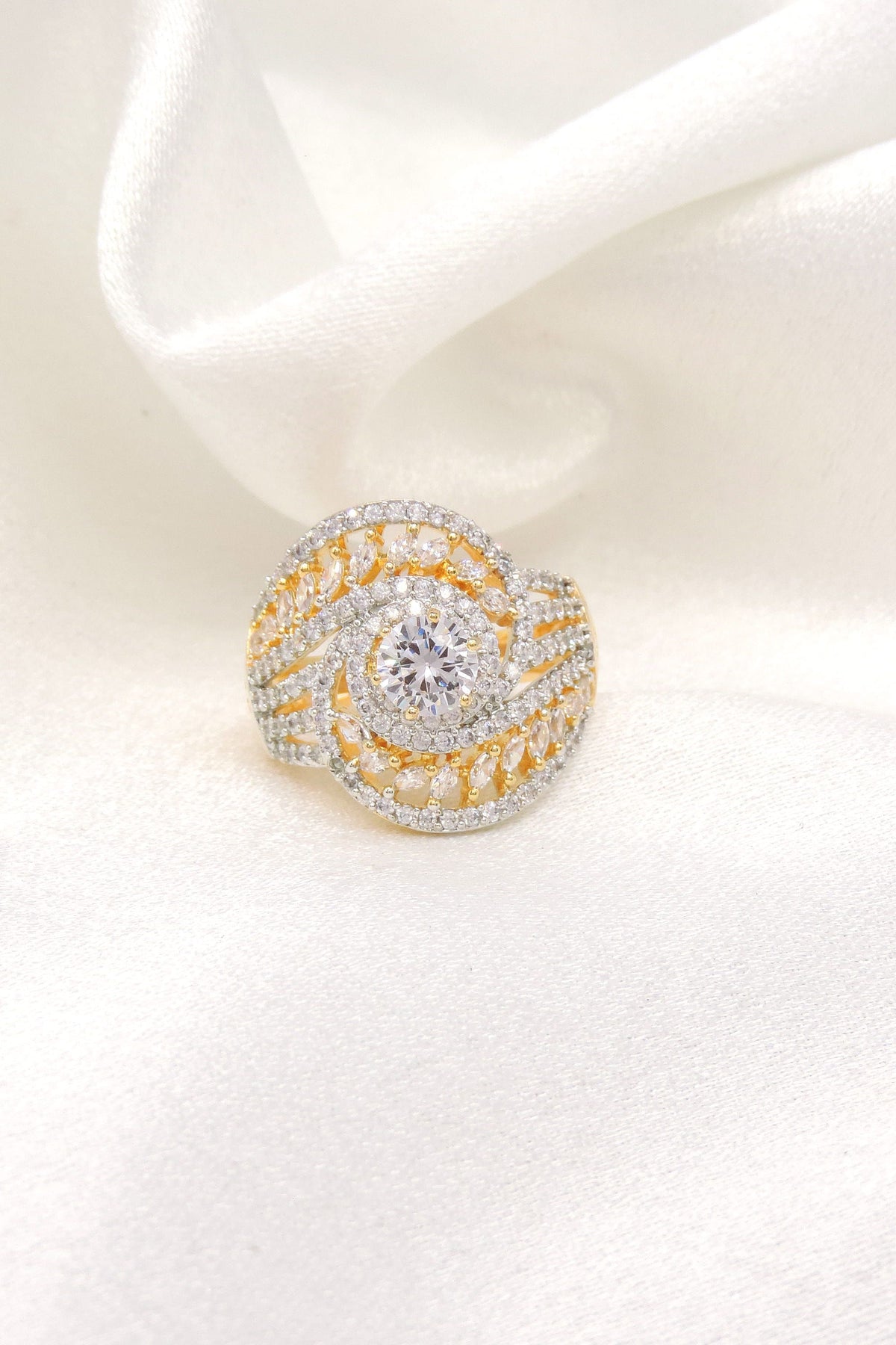 Sophisticated CZ swirled ring with gold-toned detailing by joyrias