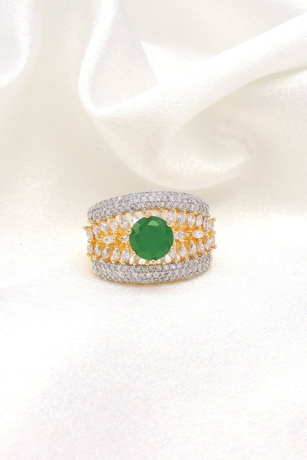 Opulent green stone CZ ring with gold-toned detailing by joyrias