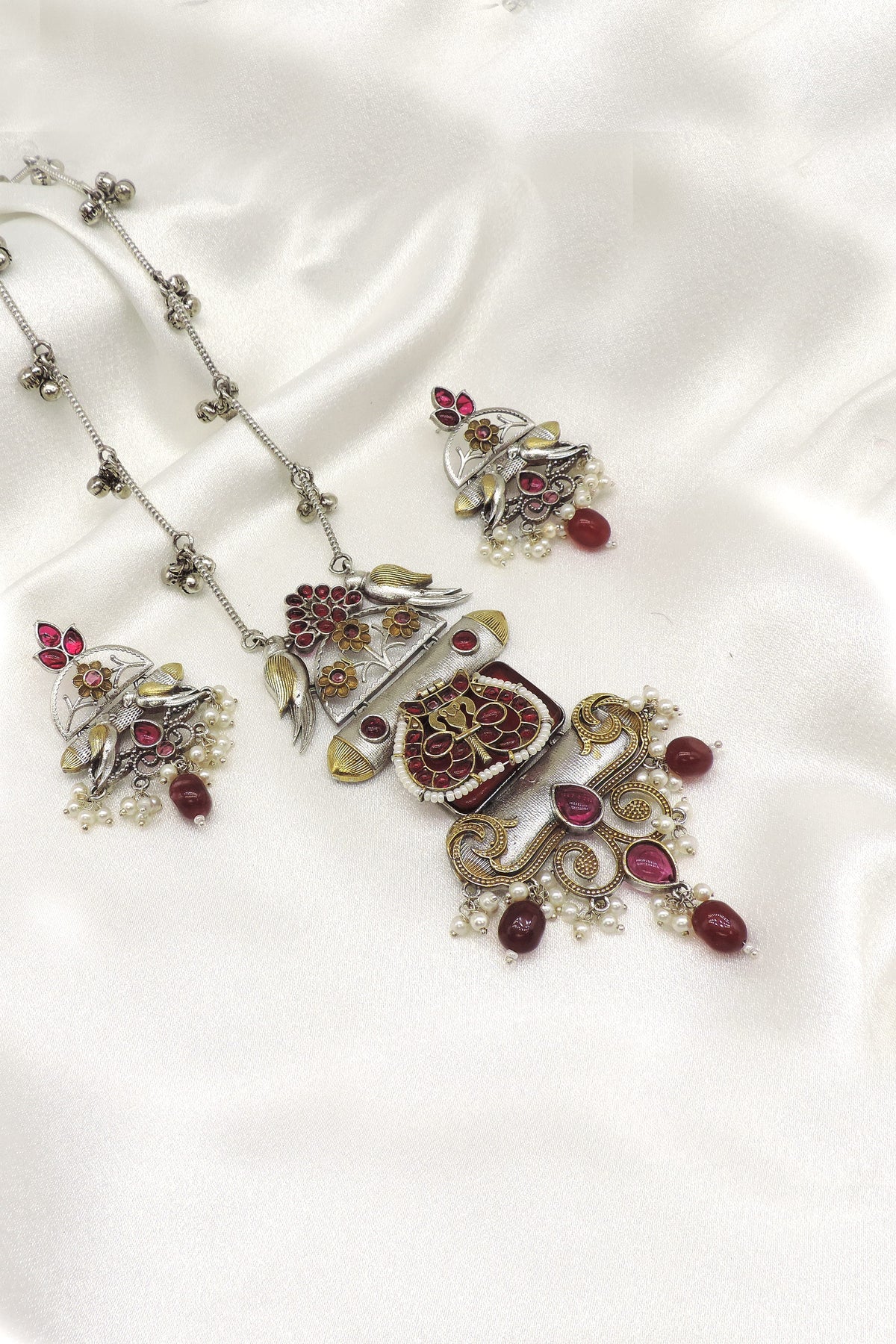 Dual tone peacock pendant set by Joyrias