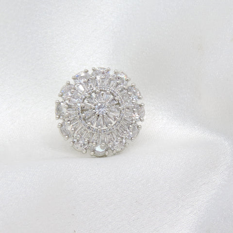 Dazzling round CZ ring with intricate baguette detailing by joyrias