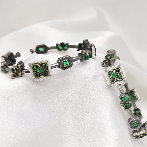 Oxidized silver green stone floral openable bangle set with pearl detailing by joyrias