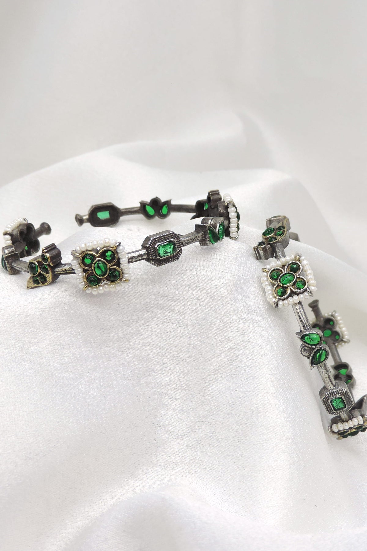 Oxidized silver green stone floral openable bangle set with pearl detailing by joyrias