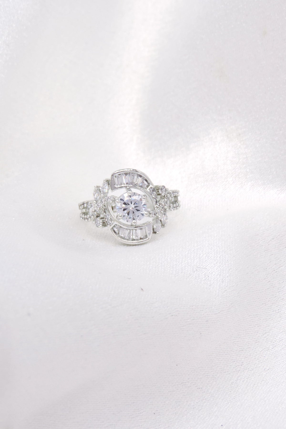 Silver-toned AD CZ ring with intricate detailing by joyrias