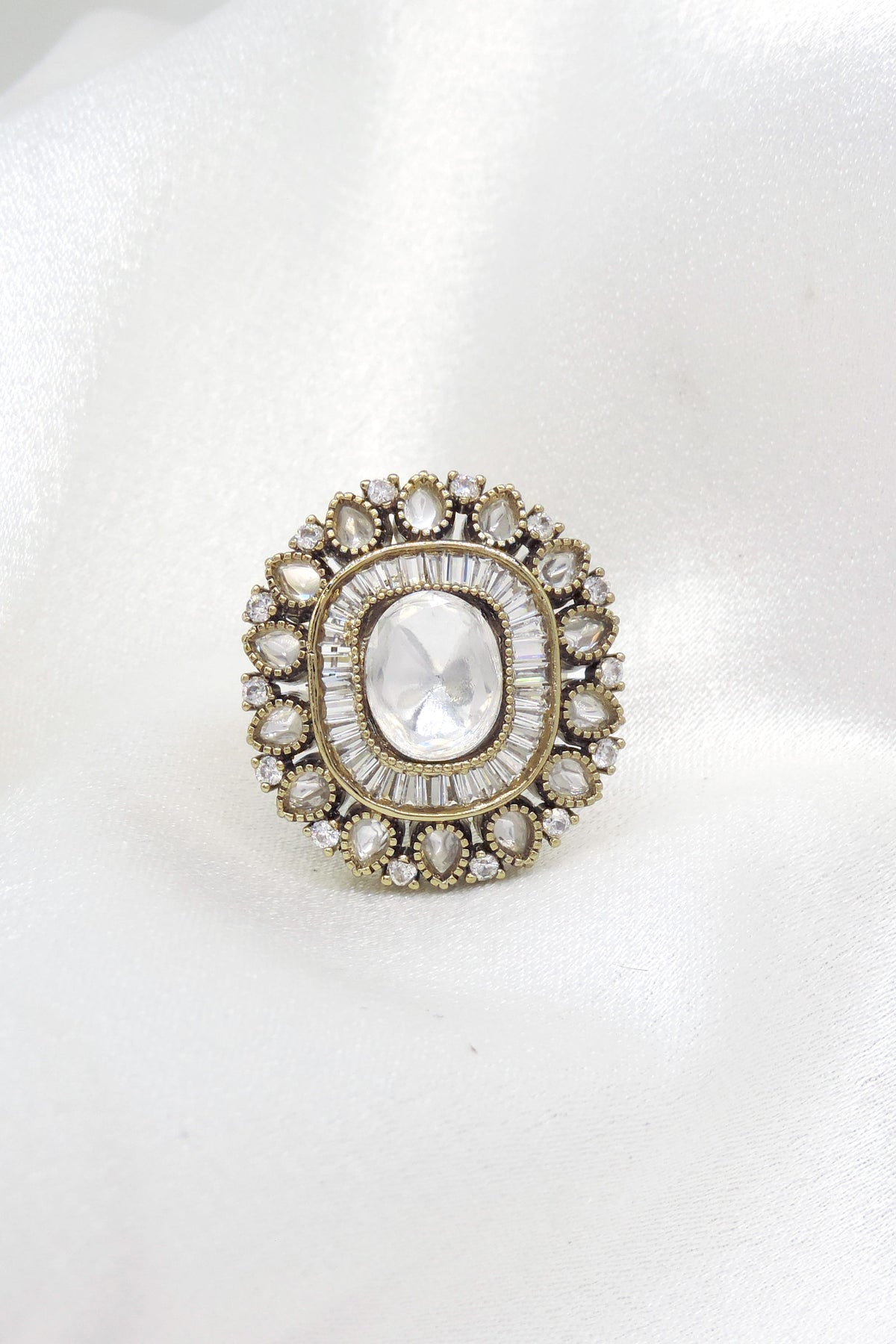 Timeless kundan oval ring with layered stone detailing by joyrias