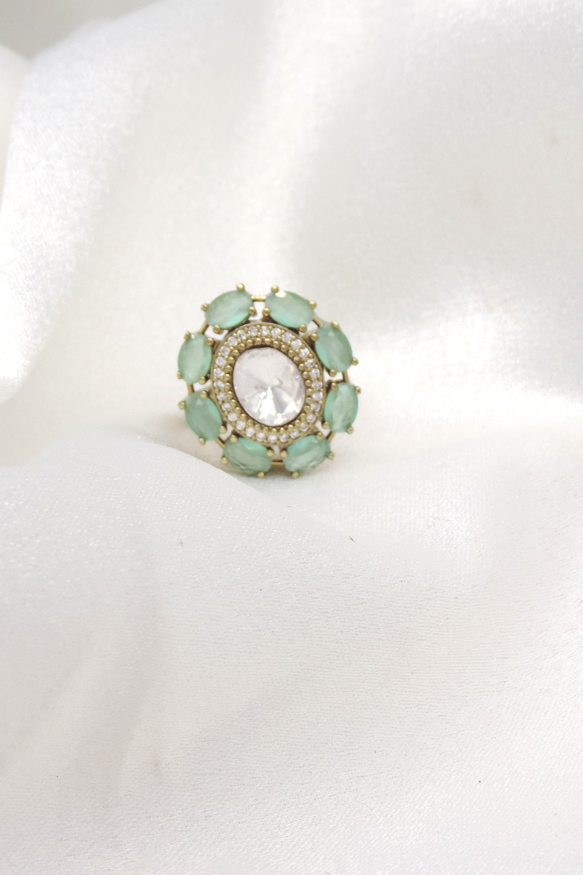 Mint green kundan ring with gold-toned detailing by joyrias