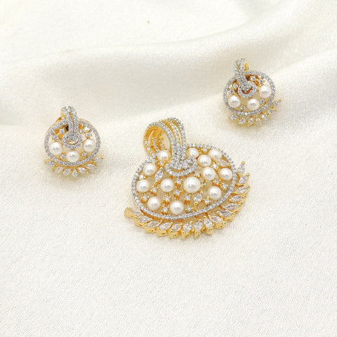 Gold plated circular pearl pendant with matching earrings and sparkling stone accents