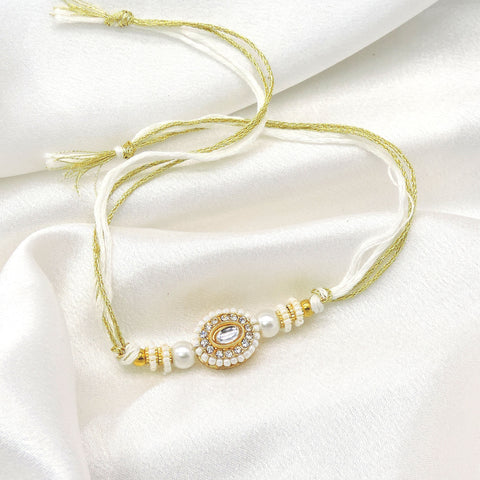 Pearl kundan rakhi by Joyrias