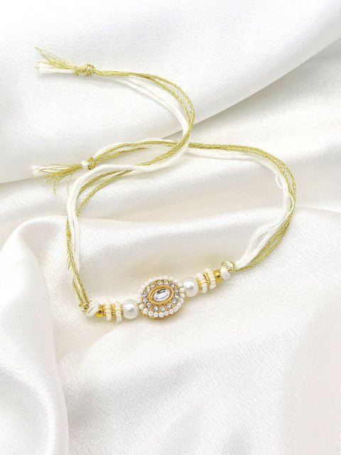 Pearl kundan rakhi by Joyrias
