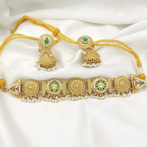 Gold-toned green kundan pearl link necklace set with matching jhumka earrings by joyrias