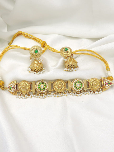 Gold-toned green kundan pearl link necklace set with matching jhumka earrings by joyrias