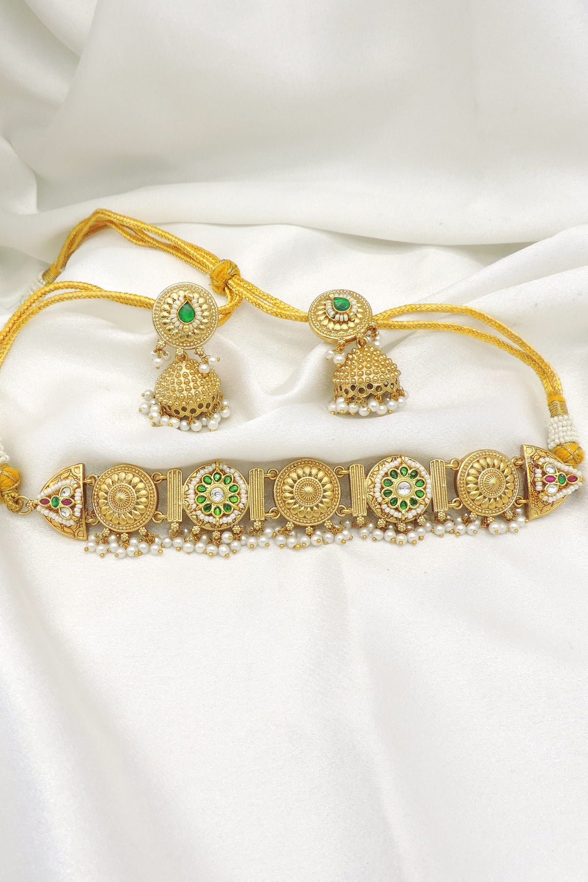 Gold-toned green kundan pearl link necklace set with matching jhumka earrings by joyrias