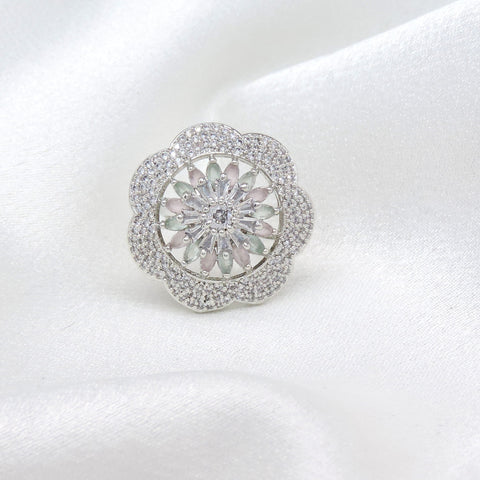 Intricate floral AD ring with sparkling center stone and delicate detailing by joyrias