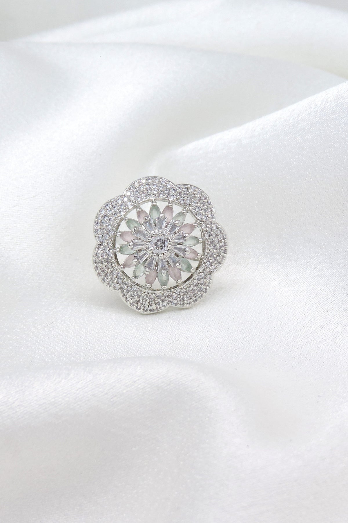 Intricate floral AD ring with sparkling center stone and delicate detailing by joyrias