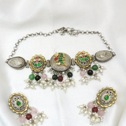 Oxidized dual-tone multicolor meenakari necklace set with pearl detailing and matching earrings by joyrias